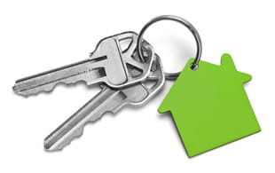 House keys with green keyfob